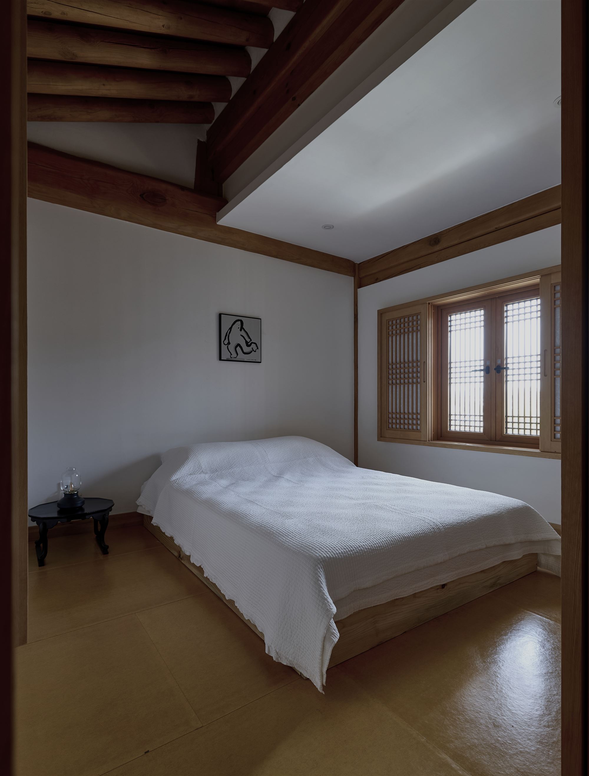 The evening bedroom lit by a single lantern