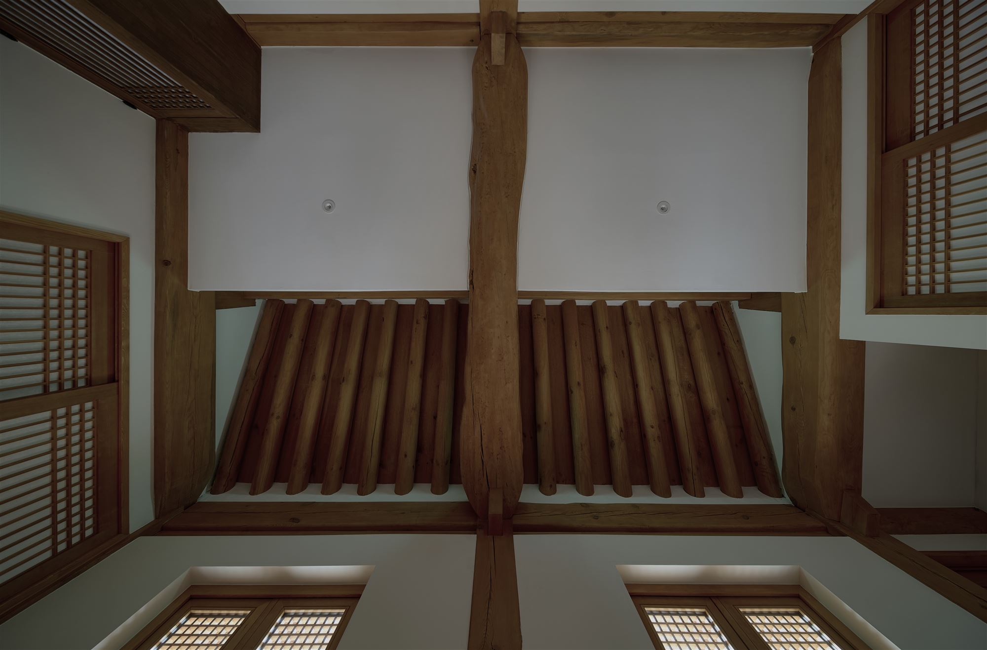 Looking up at the raftered ceiling from inside