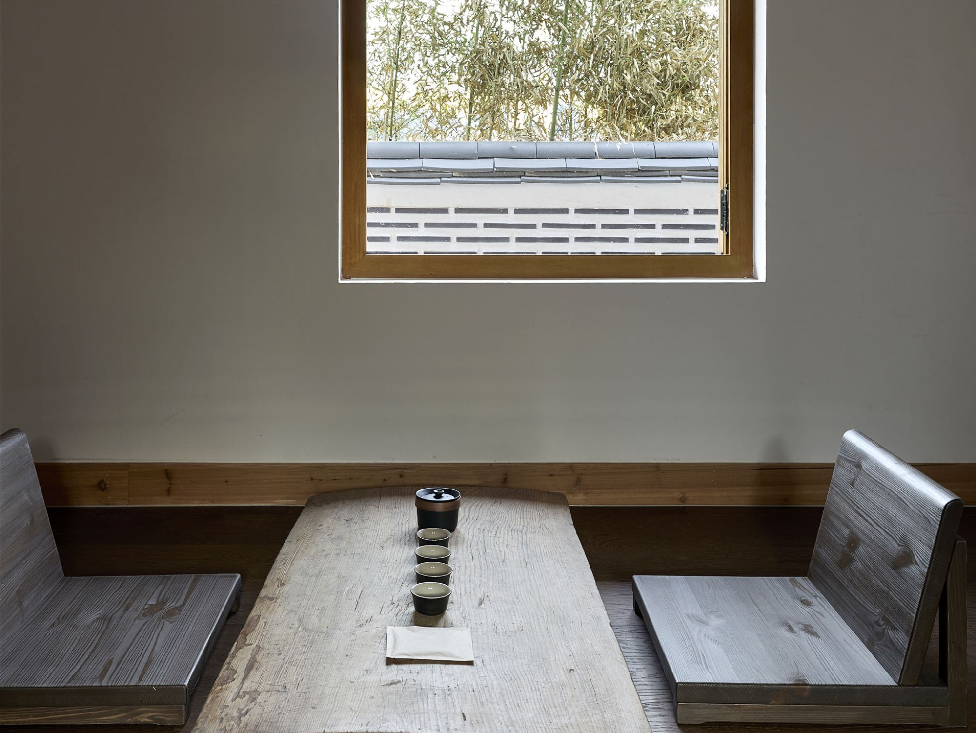 A tea table set with a handwritten guide to the tea